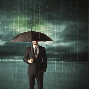 Business man standing with umbrella data protection concept on background